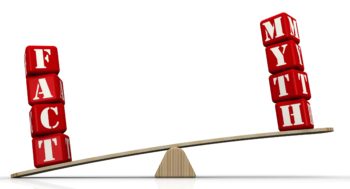The words FACT and MYTH (made from red cubes labeled with letters) are weighed on a balance. The word FACT outweighs the word MYTH.
