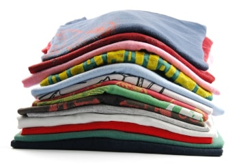 pile of colorful t-shirts isolated on white background
